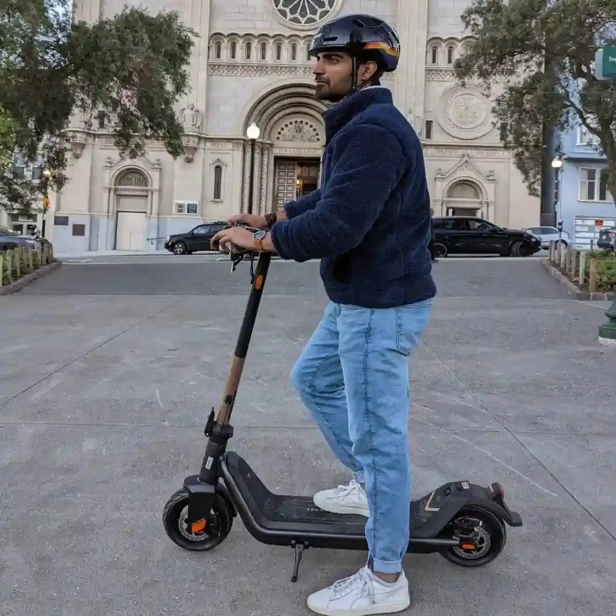 Person on scooter wearing XNITO helmet