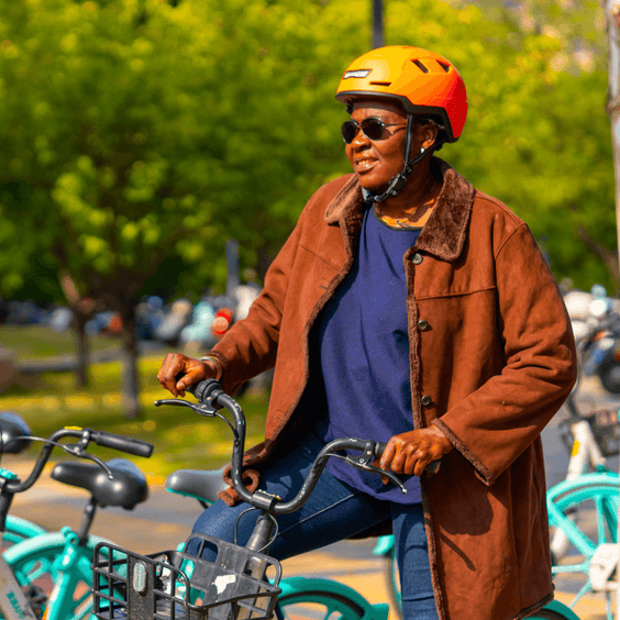 Cyclist wearing XNITO helmet on bike