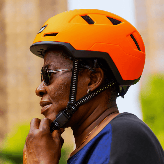 Person wearing orange XNITO helmet outdoors