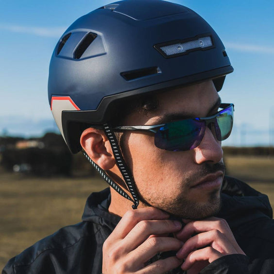 Person wearing XNITO helmet with sunglasses