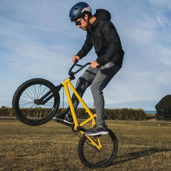 Cyclist performing stunt wearing XNITO helmet