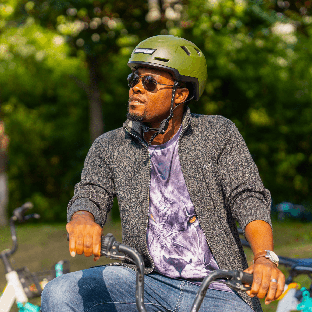 Cyclist wearing XNITO Moss helmet on bike