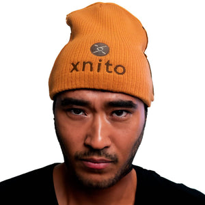 Man wearing orange Xnito beanie with logo